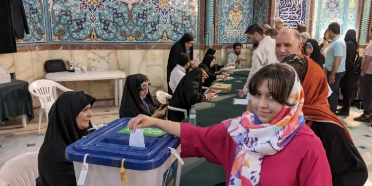 A woman casts her ballot at Hosseinieh Ershad, a major voting station in central Tehran.