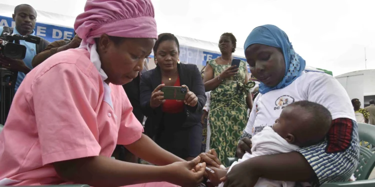 Ivory Coast Launches Latest Malaria Vaccine Campaign 1 A health worker administers the malaria vaccine to a child in Abidjan, Ivory Coast