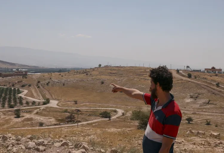 Watchdog Sheds Light On Israel’s Largest Land Grab 1 A Palestinian man points towards a spot seized by Israeli forces outside the Palestinian village of Jiftlik in the occupied West Bank.