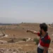 A Palestinian man points towards a spot seized by Israeli forces outside the Palestinian village of Jiftlik in the occupied West Bank.