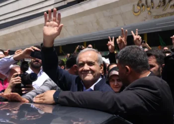 Pezeshkian Wins Iran’s Presidential Vote 1 Masoud Pezeshkian greets supporters outside a polling station in Tehran.