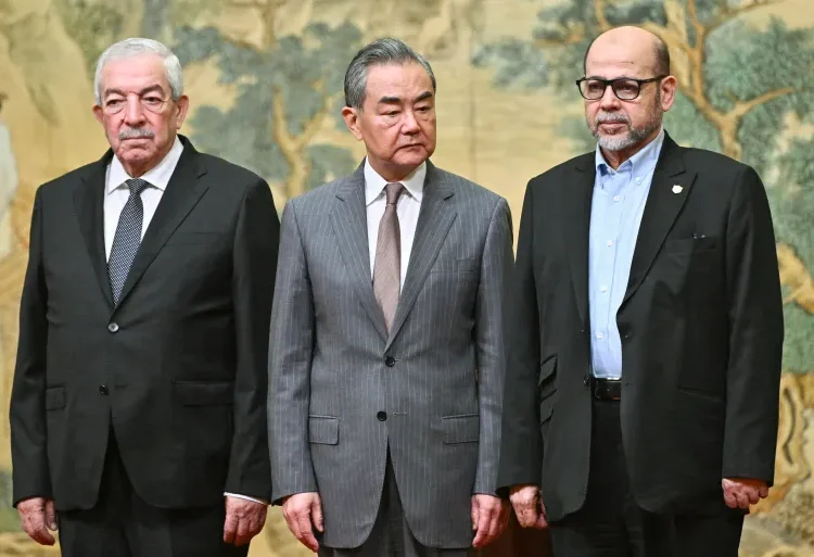 Palestinian Factions Sign Unity Agreement In Beijing 1 Mahmoud al-Aloul, Vice Chairman of the Central Committee of Fatah (L), China's Foreign Minister Wang Yi (C), and Mousa Abu Marzouk, senior Hamas member, attend an event at the Diaoyutai State Guesthouse in Beijing, July 23, 2024.