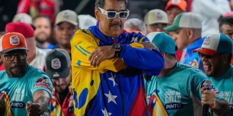 16 Allies Of Maduro Sanctioned By The US 1 Nicolas Maduro addresses supporters outside the Miraflores presidential palace.