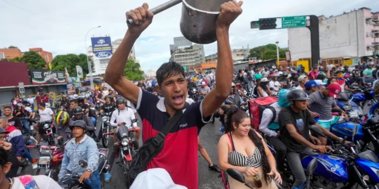 People protest the official election results declaring President Nicolas Maduro the winner of Venezuela's election in Caracas.