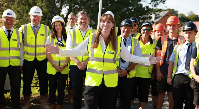 Angela Rayner with outstretched arms in the photo