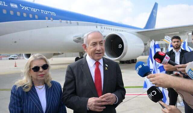 Prime Minister Benjamin Netanyahu (right) speaks to the press before departing to Washington, DC, at Ben Gurion Airport, July 22, 2024.
