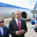 Prime Minister Benjamin Netanyahu (right) speaks to the press before departing to Washington, DC, at Ben Gurion Airport, July 22, 2024.
