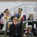 President Nicolas Maduro waving while ride at the back of a military vehicle