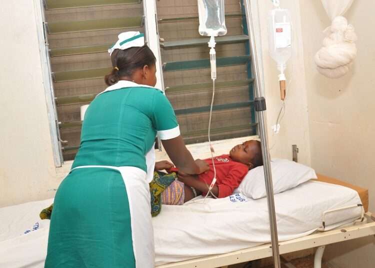 A nurse attending to a patient at a healthcare facility