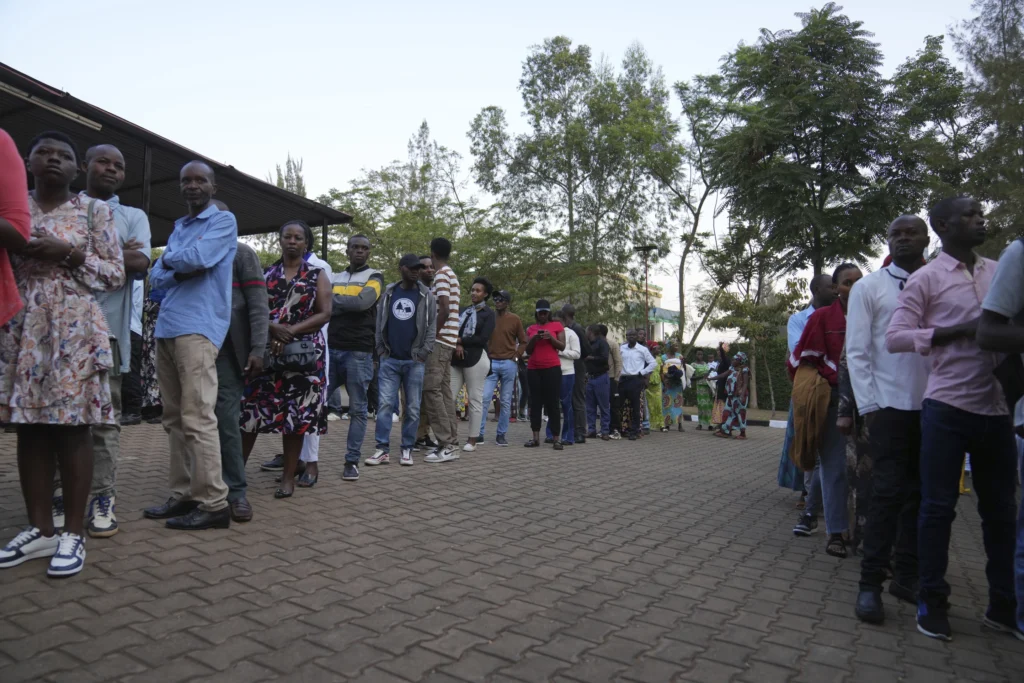 People line up to cast their vote in a presidential election in Kigali