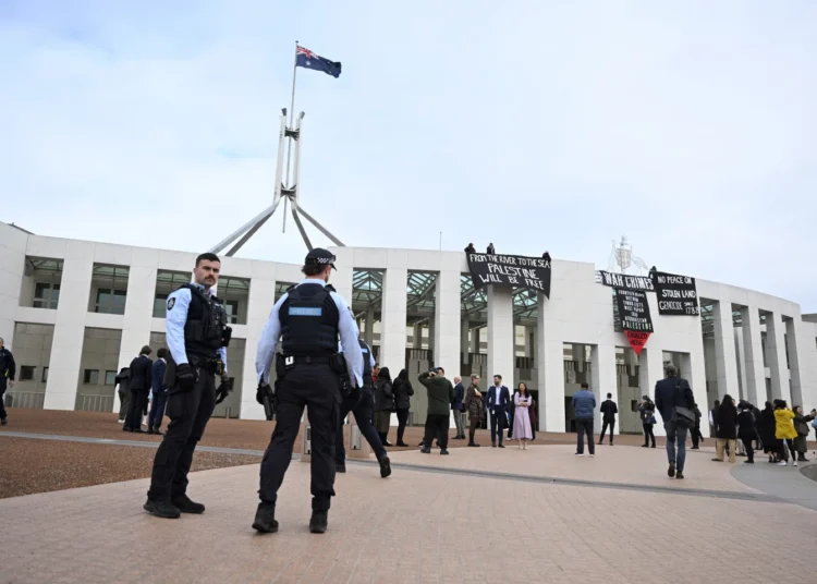 Pro-Palestinian Protest Disrupts Australia's Parliament 1 Pro-Palestine protesters hang banners over Australia's Parliament
