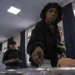 A voter casts her ballot during the second-round vote in France.