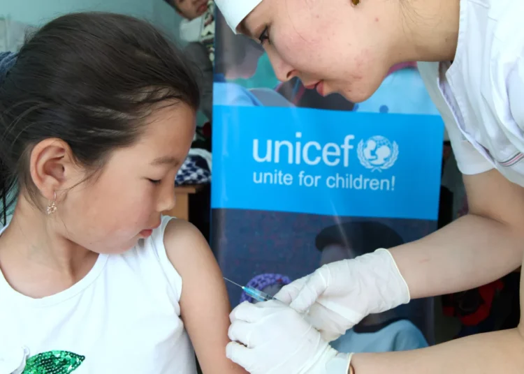 Global Immunization Coverage Stalls, Millions of Children Remain Vulnerable 1 A child being immunized