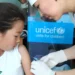 Global Immunization Coverage Stalls, Millions of Children Remain Vulnerable 11 A child being immunized