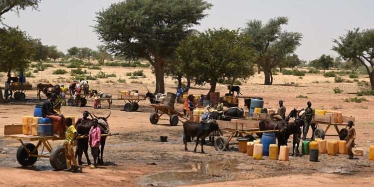 Fresh Attacks In Burkina Faso Drives Thousands Into Niger 1 Children and women collect water in a village in Niger