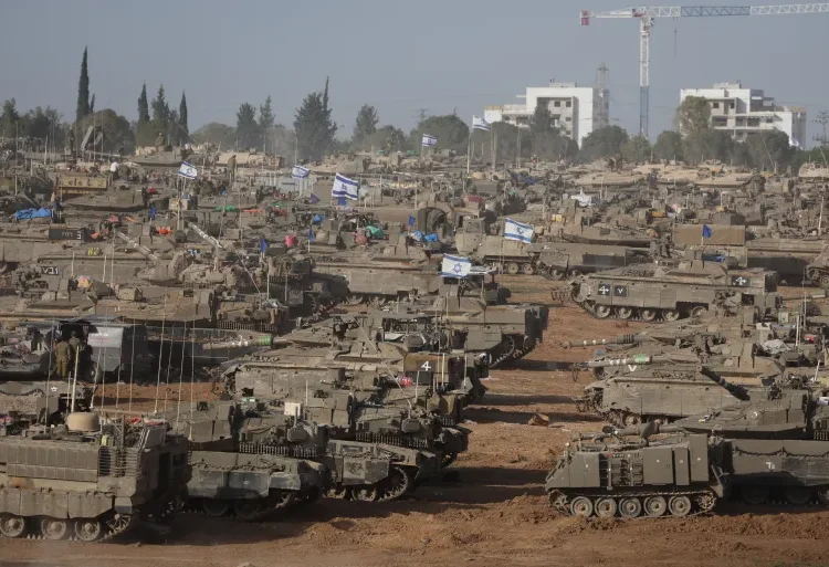 Israeli Forces Press Deeper Into Areas Of Central And Southern Gaza Strip 1 Israeli military vehicles gather near the border fence with the Gaza Strip, in southern Israel on May 9, 2024.