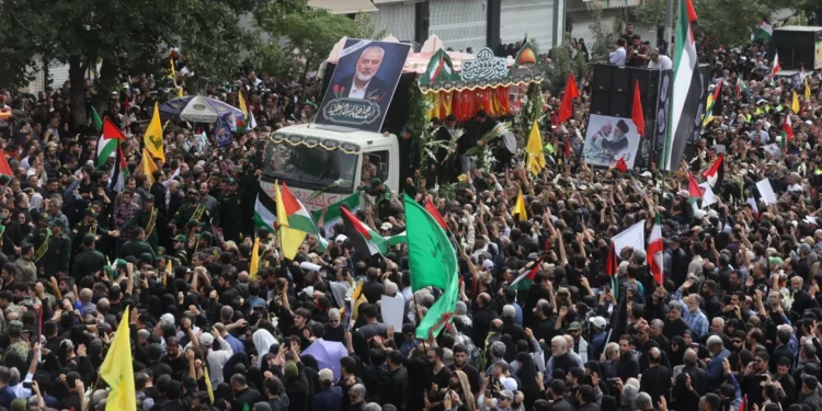 Funeral Service For Ismail Haniyeh Held In Tehran 1 Thousands of people carrying posters of Haniyeh and Palestinian flags gathered in Tehran's city centre for the funeral procession.