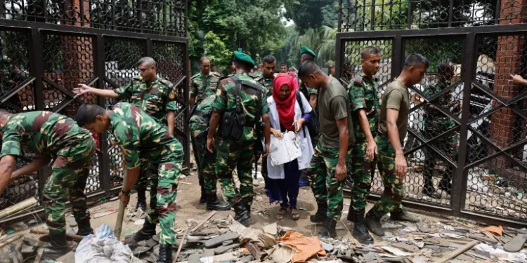 Members of the army clear an entrance of the Ganabhaban, the Bangladeshi prime minister’s residence in Dhaka, Bangladesh, on August 6, 2024.