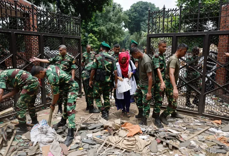 Bangladesh’s Parliament Dissolved 1 Members of the army clear an entrance of the Ganabhaban, the Bangladeshi prime minister’s residence in Dhaka, Bangladesh, on August 6, 2024.