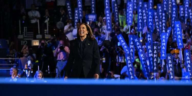 Harris Beckons America To The “New Way Forward” 1 Vice President Kamala Harris walks on stage during the DNC.