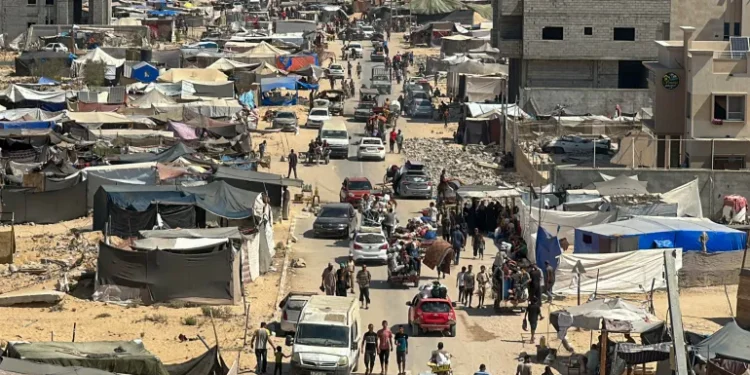 Families take what they can carry as they leave their homes and shelters in Khan Younis on August 11, 2024.