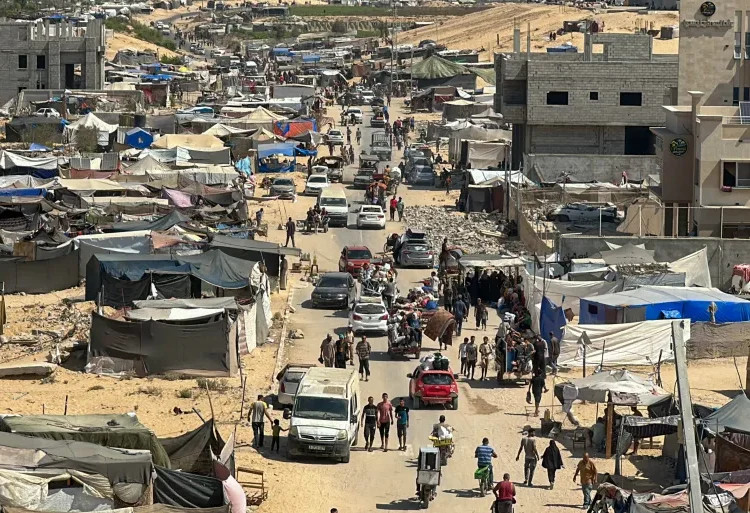 Families take what they can carry as they leave their homes and shelters in Khan Younis on August 11, 2024.