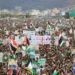 Yemenis wave flags and lift placards of Hezbollah senior commander Fuad Shukr, who was killed in an Israeli strike, and slain Hamas chief Ismail Haniyeh, during a rally in the Houthi-controlled capital Sanaa.