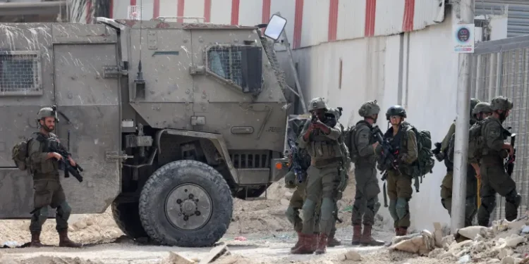 Israeli soldiers operate during a raid in the Nur Shams camp near Tulkarem in the Israeli-occupied West Bank, on August 28, 2024.