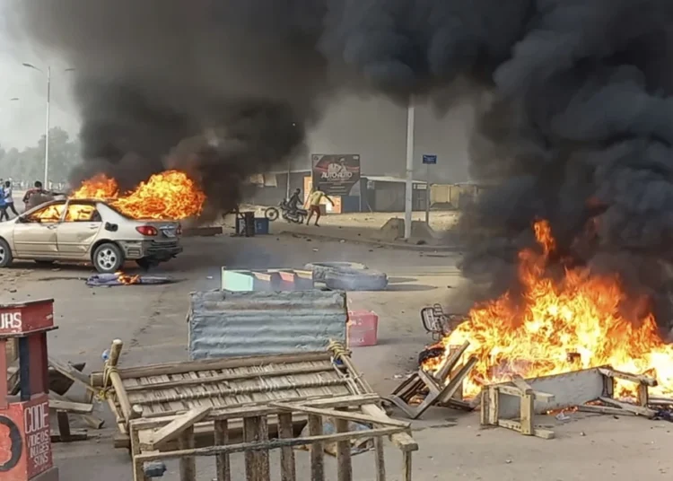 Chad's Military Faces Accusations Over Detainee Deaths 1 Anti-government demonstrators set a barricade on fire during clashes in N’Djamena, Chad, on Oct. 20, 2022.