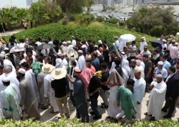 People gather at the Imam Muhammad ibn Abd al-Wahhab Mosque in Doha for prayers before the burial of Hamas leader Ismail Haniyeh.