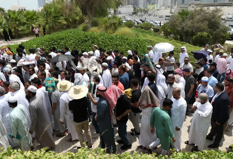 People gather at the Imam Muhammad ibn Abd al-Wahhab Mosque in Doha for prayers before the burial of Hamas leader Ismail Haniyeh.
