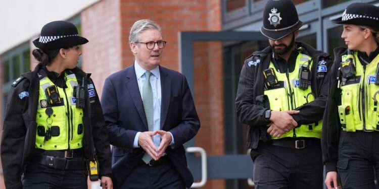 UK Government Targets Online Hate After Unrest 1 Keir Starmer with some police officers