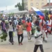 People wave Russian flags during a protest in Kaduna, Nigeria, Monday, Aug 5, 2024.