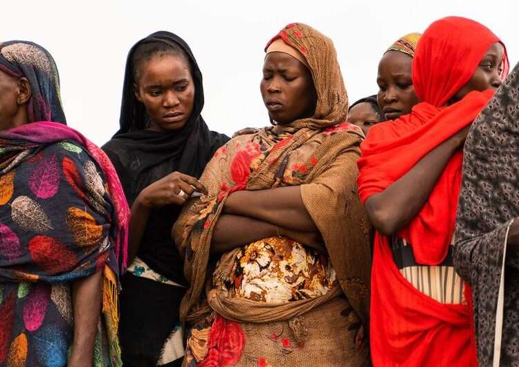 Women waiting for aid distribution in Wad Madani, Sudan.