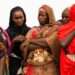 Women waiting for aid distribution in Wad Madani, Sudan.