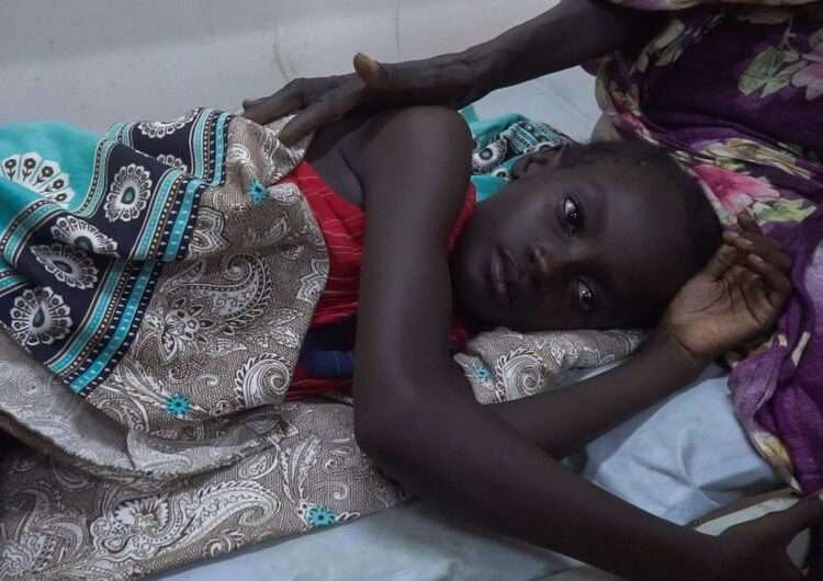A young girl receives treatment at a hospital in Khartoum, Sudan