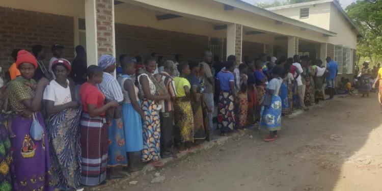 People queue for food at a World Food Programme distribution center in Neno district southern Malawi