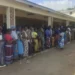People queue for food at a World Food Programme distribution center in Neno district southern Malawi