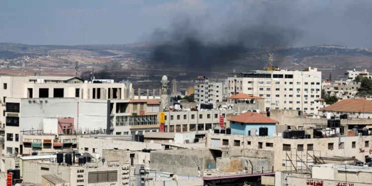 Smoke billows during an Israeli raid in Jenin, the Israeli-occupied West Bank.