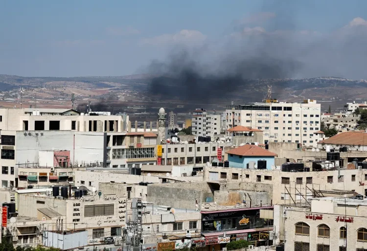 OCHA Issues Warning On Israel’s Use Of ‘Lethal War-Like Tactics’ In West Bank 1 Smoke billows during an Israeli raid in Jenin, the Israeli-occupied West Bank.