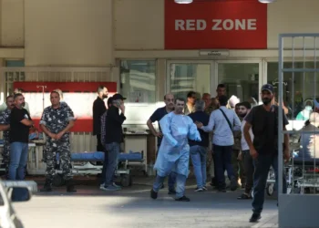 People gather outside a hospital in Beirut.