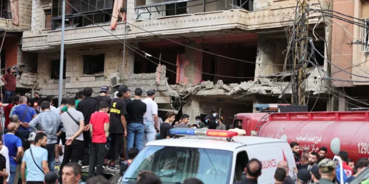Israel Strikes Beirut 1 People inspect the site of an Israeli strike in the southern suburbs of Beirut, September 20, 2024.
