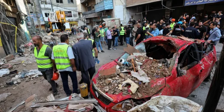Palestinian Ministry Warns Widened War Shifts Attention Away From Gaza 1 Lebanese civil defence clears rubble of building destroyed by Israeli air raid on the Dahiyeh neighbourhood of Beirut, September 24, 2024.