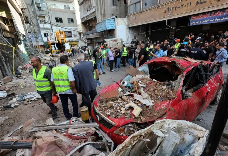 Palestinian Ministry Warns Widened War Shifts Attention Away From Gaza 1 Lebanese civil defence clears rubble of building destroyed by Israeli air raid on the Dahiyeh neighbourhood of Beirut, September 24, 2024.