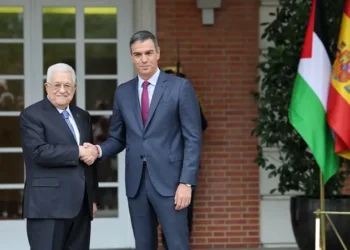 Spain's Prime Minister Pedro Sanchez (R) welcomes Palestinian president Mahmoud Abbas as he arrives before their meeting at La Moncloa Palace in Madrid on September 19, 2024.