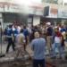 People and first responders gather at the scene of a reported device explosion in Saida in southern Lebanon.