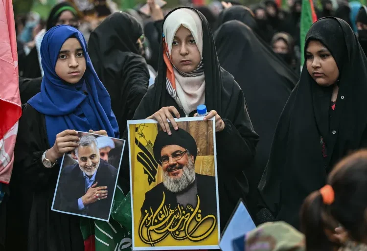 Thousands In Pakistan Protest Killing Of Hezbollah Leader 1 Three girls take part in a protest march to condemn the killing of Hassan Nasrallah, late leader of the Lebanese group Hezbollah, in Islamabad, Pakistan on September 29, 2024.
