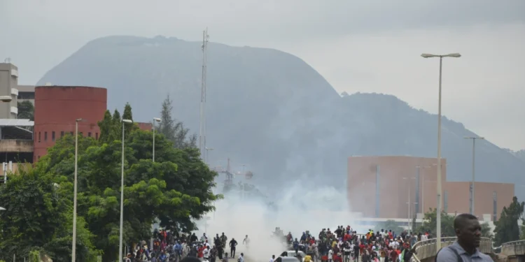 Nigerian Protesters Face Death Penalty Over Treason Charges 1 Police fire tear gas during a protest in Abuja, Nigeria, Aug. 1, 2024.
