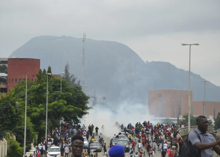 Police fire tear gas during a protest in Abuja, Nigeria, Aug. 1, 2024.