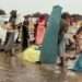 Sudan Conflict Triggers Widespread Starvation and Refugee Crisis 12 Refugees build makeshift shelters during the rainy season in Adre, eastern Chad.